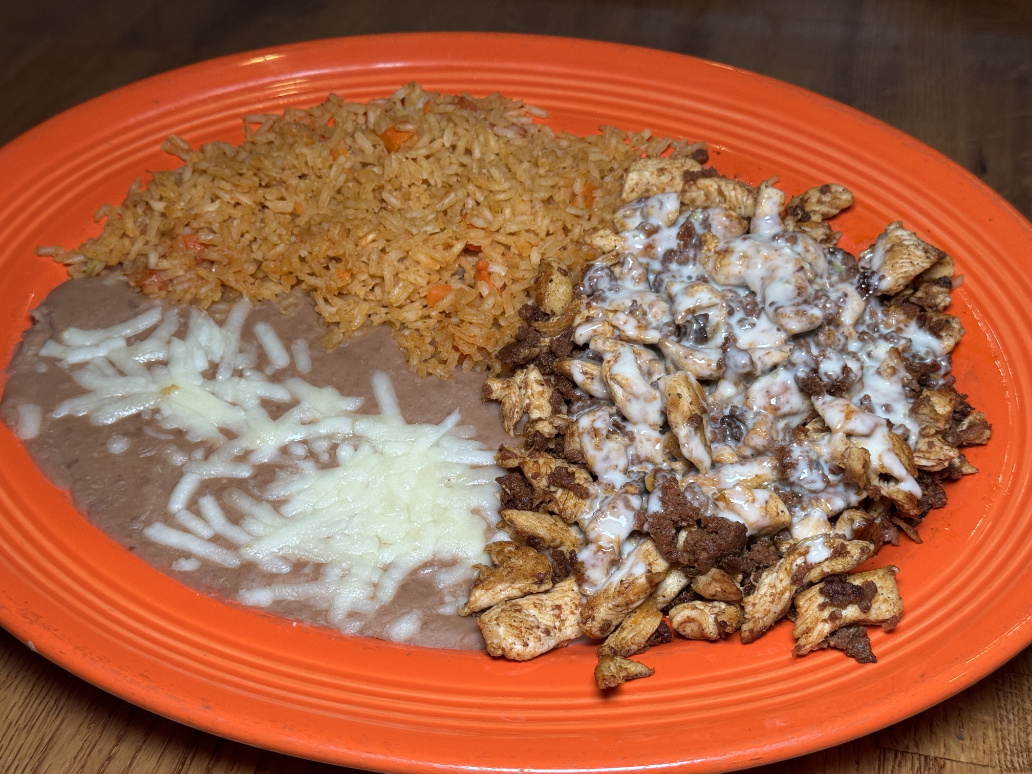 Pollo Feliz served with rice and beans