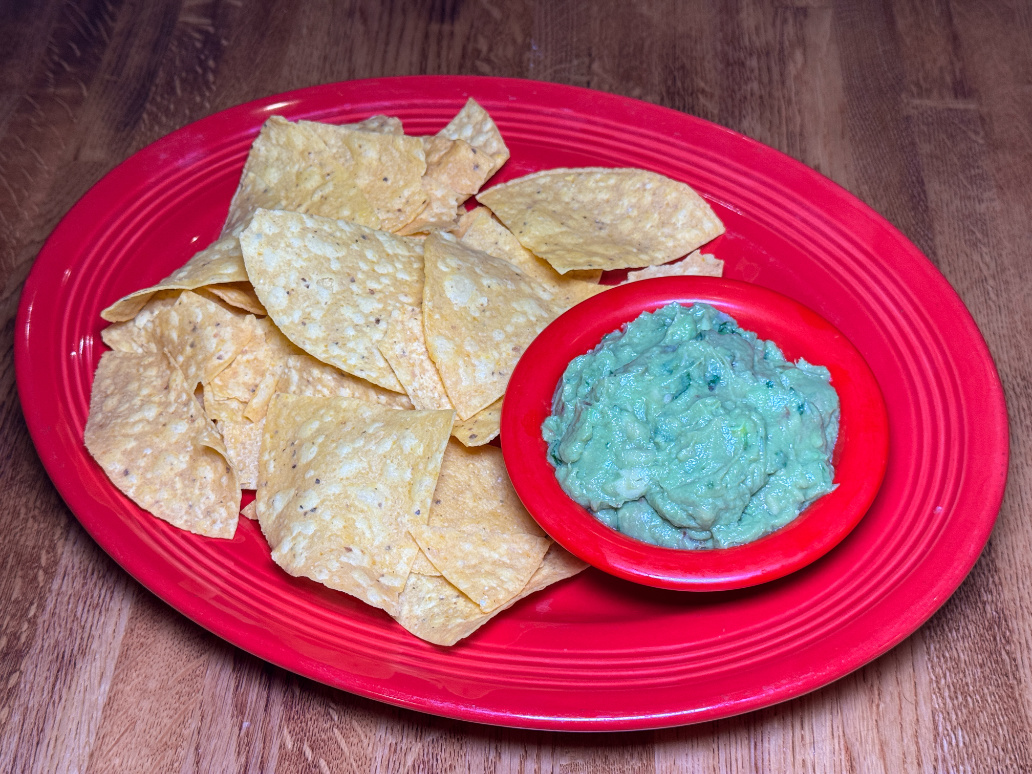 Fresh guacamole with tortilla chips