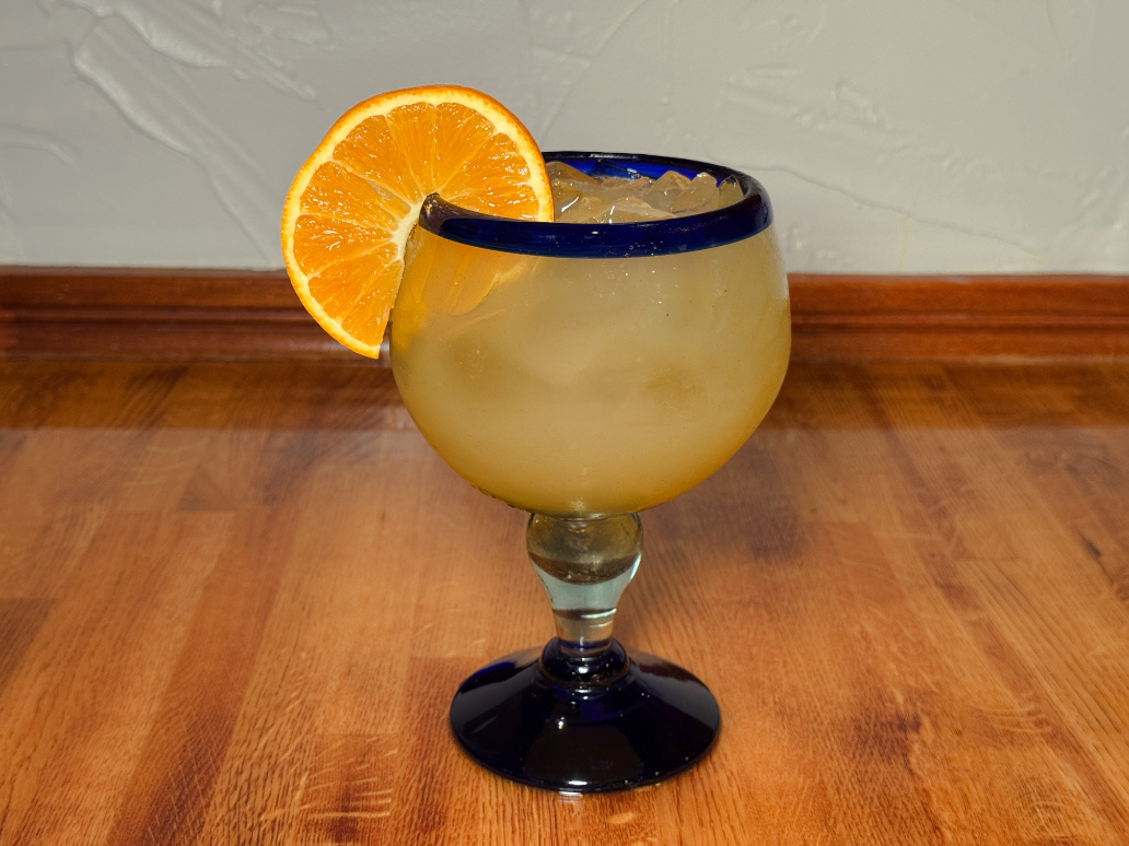 Hand-crafted margarita with orange slice